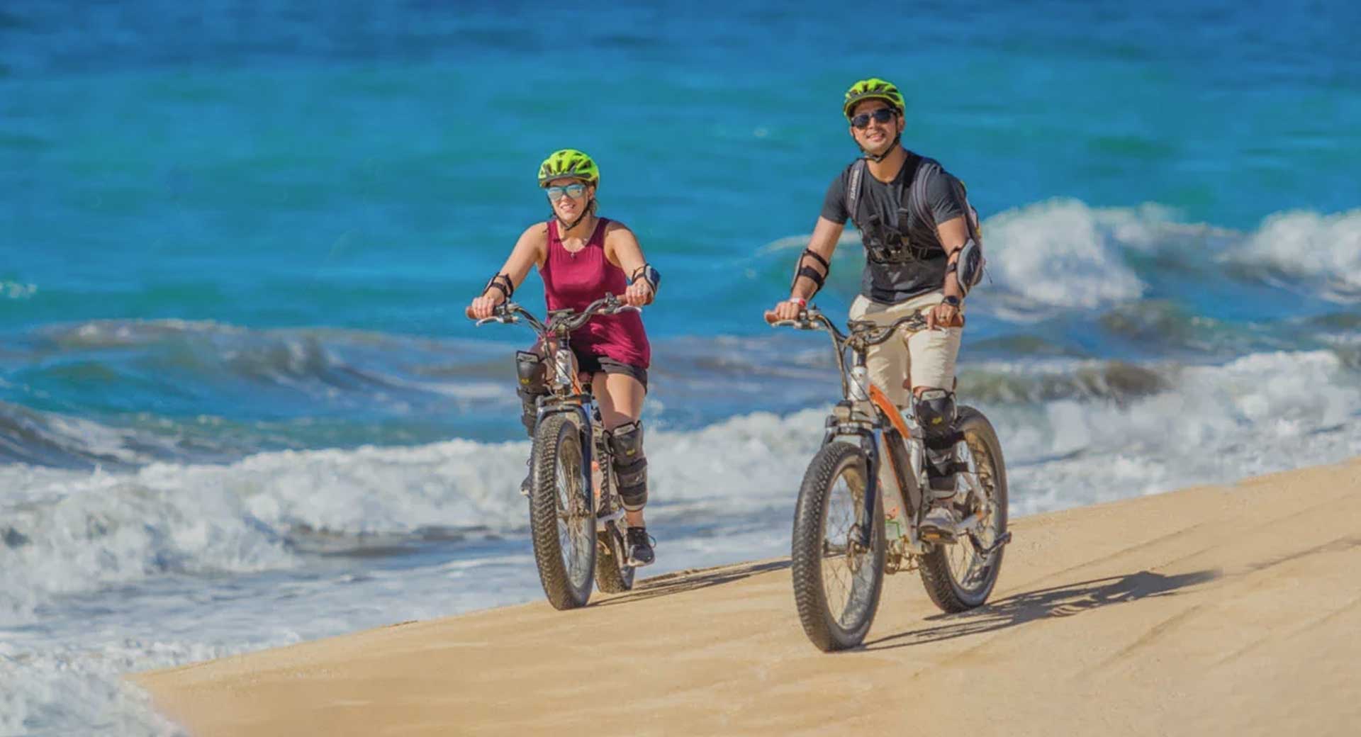 Riding fat tire e-bikes on the beach in Cabo with Cabo Adventures.