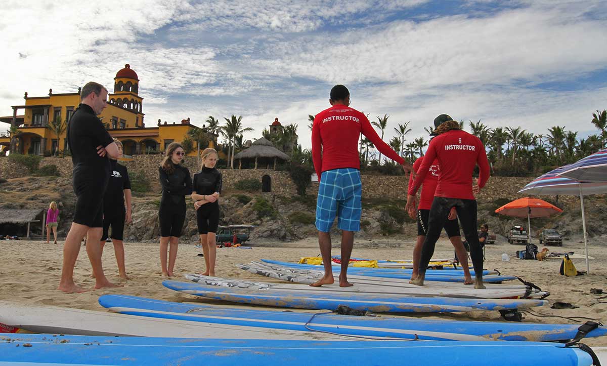 Parasailers enjoy an up close view of Land's End and the Arch in Cabo